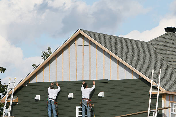 Professional Siding technician working in Midland, NC
